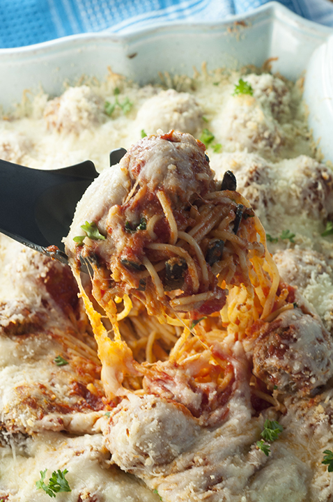 Italian Baked Spaghetti and Meatballs Casserole is a delicious change from your everyday pasta and sauce. This will be a new family favorite comfort food recipe!