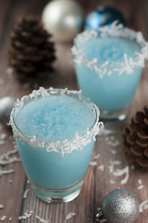 Blue Christmas Coconut Cocktail recipe is the best boozy Christmas drink and is sure to put a smile on everyone's faces! This is perfect for serving at a party and you can make a huge batch of it.