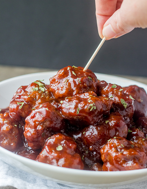 Sweet and tangy spicy Cranberry BBQ Cocktail Meatballs recipe perfect for an easy holiday appetizer or make it into a meal served over rice! These would be a hit for parties, Christmas Eve appetizer or New Year's Eve appetizer.