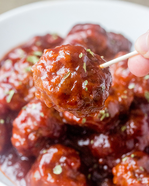 This sweet and tangy Cranberry BBQ Cocktail Meatballs recipe is fitting for an easy holiday appetizer or make it into a meal served over rice! These would be a hit for parties, Christmas Eve or New Year's Eve.