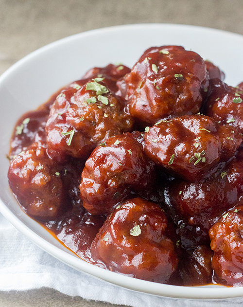 This sweet and spicy Cranberry BBQ Cocktail Meatballs recipe is fitting for an easy holiday appetizer or make it into a meal served over rice! These would be a hit for parties, Christmas Eve or New Year's Eve.