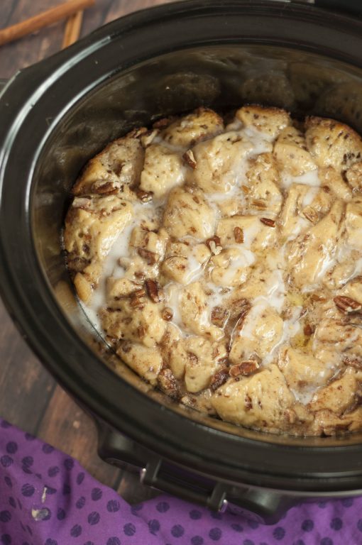Easy Slow Cooker Crock Pot Cinnamon Bun French Toast has all the flavors of gourmet cinnamon rolls without all of the hard work! This is perfect for the busy holiday mornings!