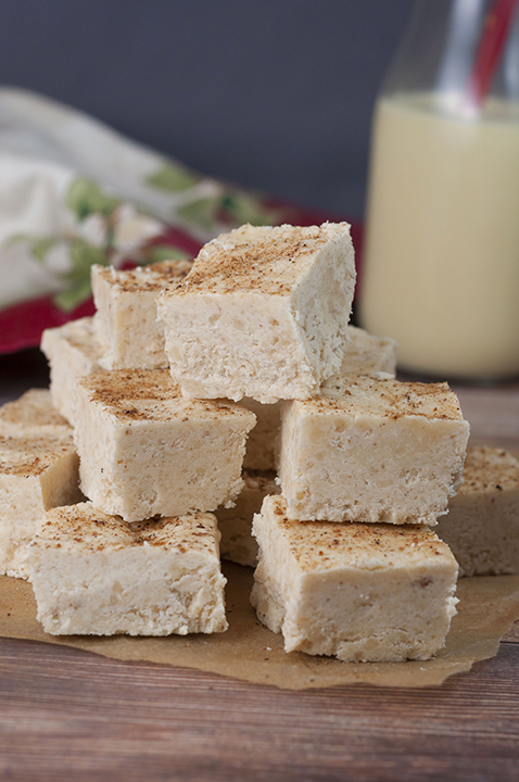 This Smooth and Creamy Holiday Eggnog Fudge recipe is your favorite holiday beverage turned into the perfect Christmas dessert for your holiday parties! You'll love the sprinkle of nutmeg on top!