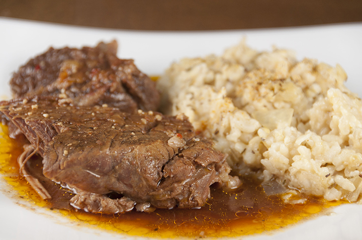 Tender, fall-apart, juicy Slow Cooker Italian Pot Roast recipe is packed with flavor and an easy weeknight dinner. It's fancy enough to serve to dinner guests for a holiday meal and the crock pot does all the work!