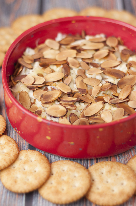 Toasted Almond Cheese Dip recipe is a quick and easy dip recipe for the Christmas, Super Bowl, or game day appetizer idea! Who doesn't love a hot, creamy cheese dip topped with crunchy sliced almonds?