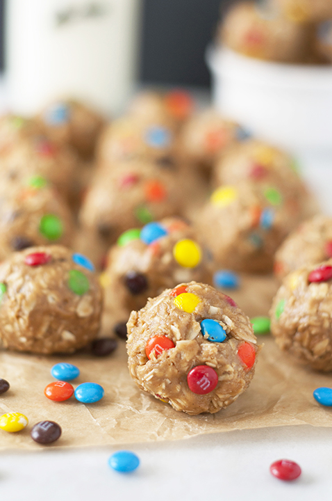 Healthy No-Bake Monster Cookie Dough Energy Bites are a gluten-free recipe suitable for a snack, breakfast, or dessert that will satisfy your sweet tooth without being tons of sugar!