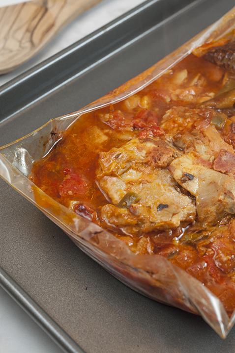 Taking the Chicken Cacciatore out of the oven.