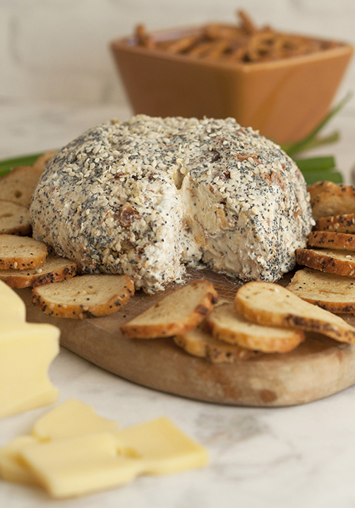 Get the Super Bowl, Christmas, or holiday party started with this Everything Bagel Cheese Ball recipe: all the flavors of your favorite everything bagel turned into a delicious, easy cheese ball appetizer! Serve it with bagel chips or pretzels!