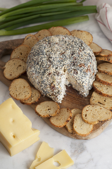 Get the Super Bowl, Christmas, Easter, or holiday party started with this Everything Bagel Cheese Ball recipe: all the flavors of your favorite everything bagel turned into a delicious, easy cheese ball appetizer! Serve it with bagel chips, crackers or pretzels!