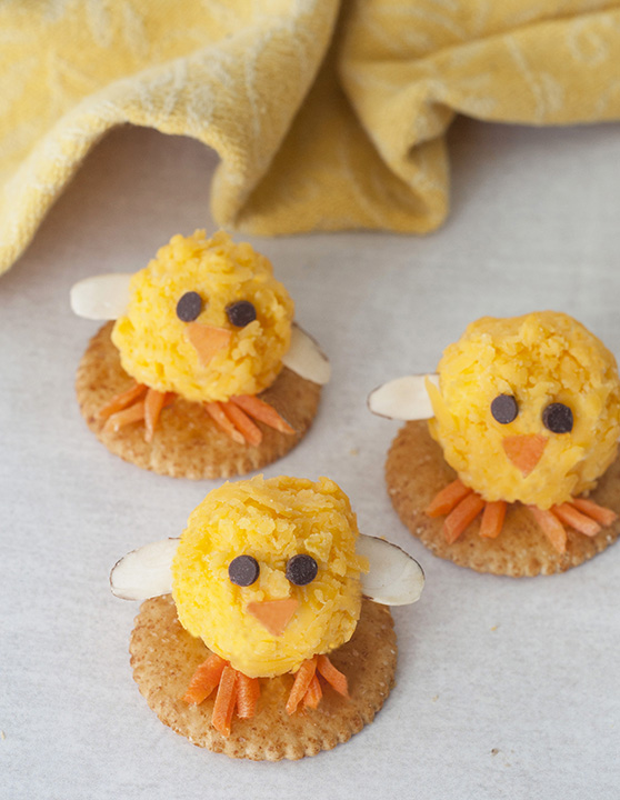 Baby Chick Mini Cheese Balls recipe would be the cutest addition to your holiday table for an Easter appetizer idea or a fun snack idea! They are so easy to make and perfect for adults and kids to eat on the Easter holiday.