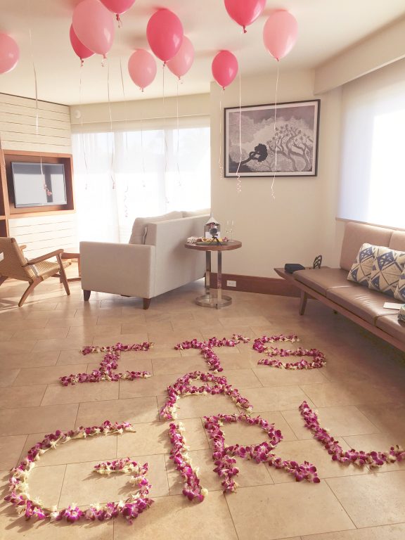 The Andaz Maui gender reveal in our resort suite complete with balloons and flowers.