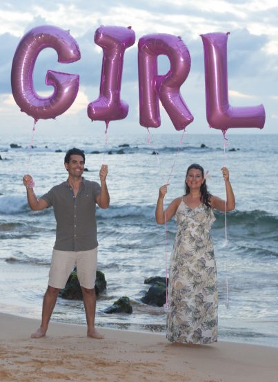 Official Gender Reveal photo we took on the beach in Maui, Hawaii with balloons.