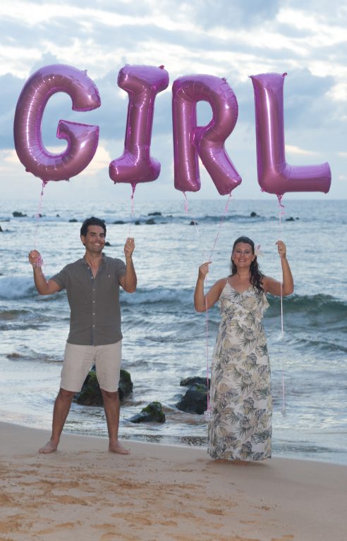 Official Baby Gender Reveal photo we took on the beach in Maui, Hawaii with balloons.