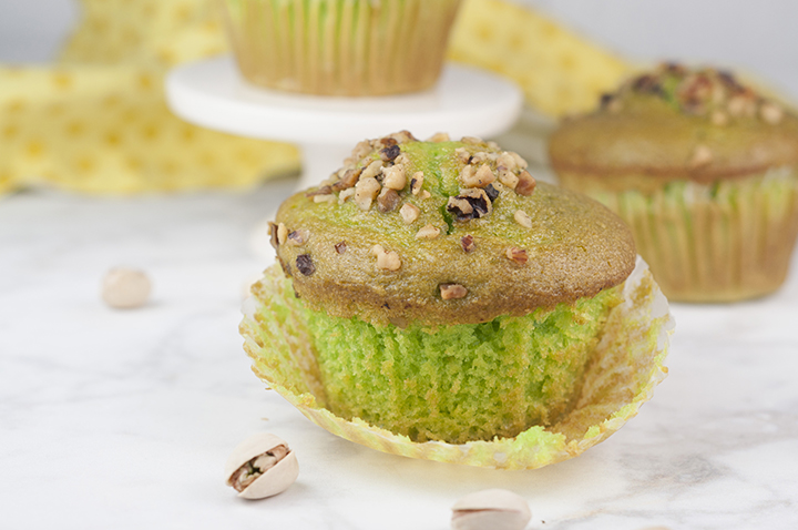 Easy, moist Green Walnut Pistachio Muffins recipe that is great for St. Paddy's day breakfast, dessert, or Easter breakfast and brunch idea! You'll love that special crunch from the nuts on top!