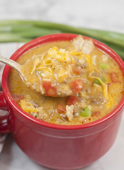 Your favorite nacho flavors and toppings turned into an easy soup recipe loaded with beef and cheese. This Easy Beef Nacho Soup is great for a quick lunch or fast dinner and the whole family will ask for seconds!