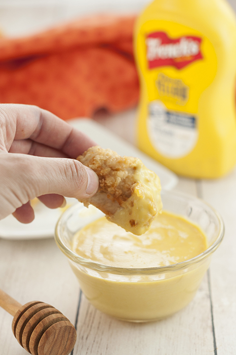 Extremely easy smooth and creamy 4 ingredient Honey Mustard Dipping Sauce recipe you can dip pretzels or French fries in, spread on grilled chicken, potatoes, mini meatballs, and more!