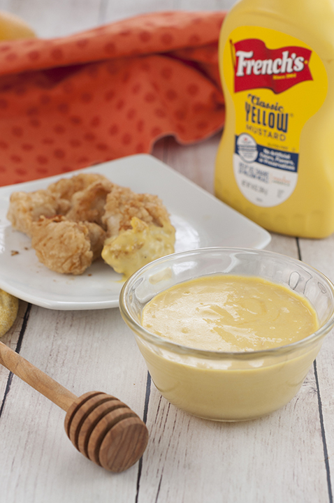 Extremely easy smooth and creamy 4 ingredient Honey Mustard Dipping Sauce recipe you can dip soft pretzels or French fries in, spread on grilled chicken, potatoes, mini meatballs, and more!