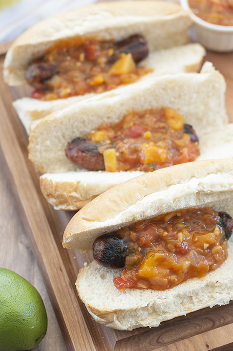 Easy Grilled Beer Brats with Mango Lime Salsa is a hearty, delicious meal made right on the grill for 4th of July, cookouts, and all of those summer barbeques!