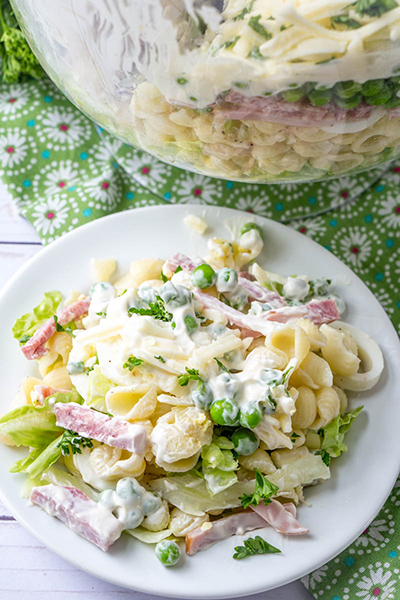 Beautiful, Simple Make-Ahead Eight Layer Salad recipe for the most foolproof, colorful salad great for entertaining, potlucks, or summer picnic side dish idea! It is so easy and you can make it ahead of time for a party, 4th of July or Father's Day BBQ!