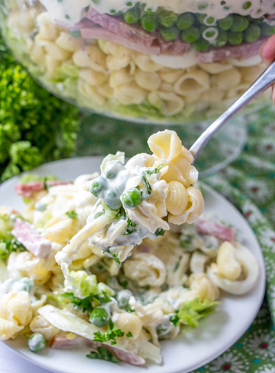 Simple Make-Ahead Eight Layer Salad recipe for the most foolproof, colorful salad great for entertaining, potlucks, or summer picnic side dish idea! It is so easy and you can make it ahead of time for a party or Father's Day BBQ!