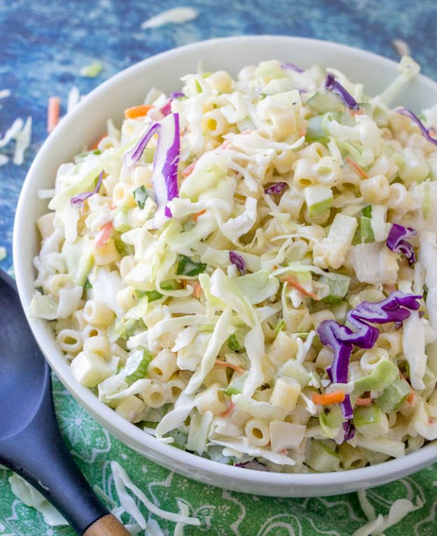 Macaroni Coleslaw Salad is packed with vegetables and pasta and a beautiful combination of your two favorite summer side dishes: coleslaw and macaroni salad! This is a great, easy recipe to take to a potluck or BBQ.