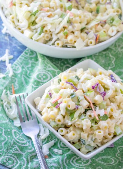 Easy Macaroni Coleslaw Salad is packed with colorful vegetables and pasta and a beautiful combination of your two favorite summer side dishes: coleslaw and macaroni salad! This is a great, easy recipe to take to a potluck, picnic or BBQ. Perfect for Labor Day!