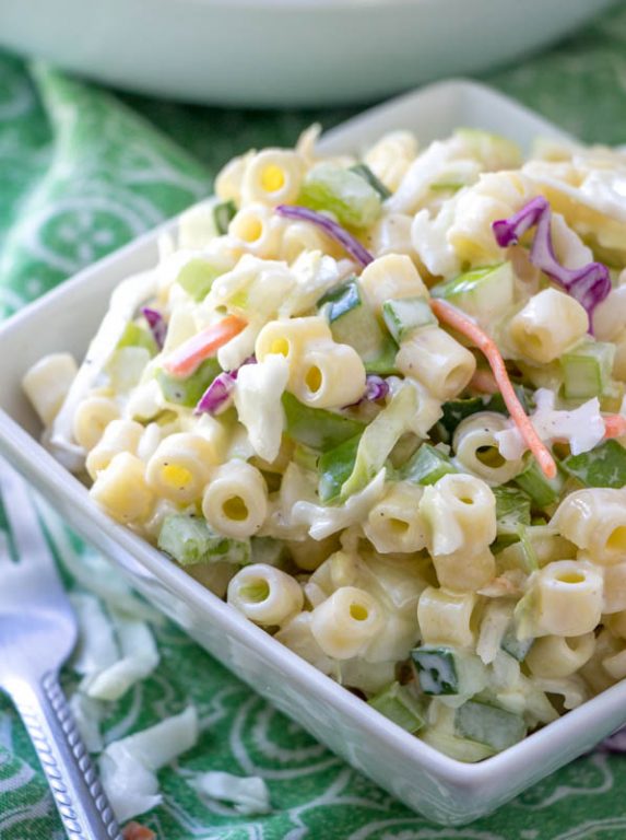Easy Macaroni Coleslaw Salad is packed with colorful vegetables and pasta and a beautiful combination of your two favorite summer side dishes: coleslaw and macaroni salad! This is a great, easy recipe to take to a potluck, holiday, picnic or BBQ.