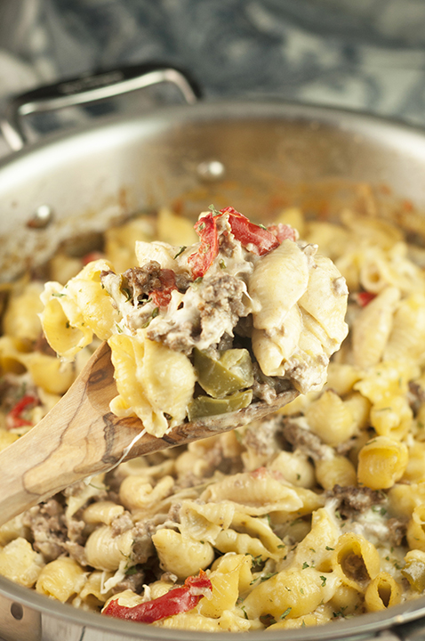 This easy dinner recipe for Philly Cheesesteak Pasta is a cheesy comfort food dish loaded with cheese and peppers that will become a new family favorite!