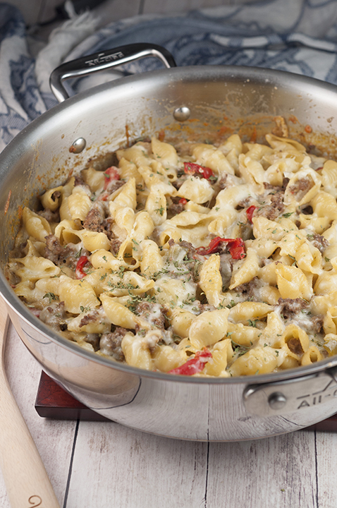 An easy dinner recipe for Philly Cheesesteak Pasta is a cheesy comfort food dish loaded with cheese and peppers that will become a new family favorite!