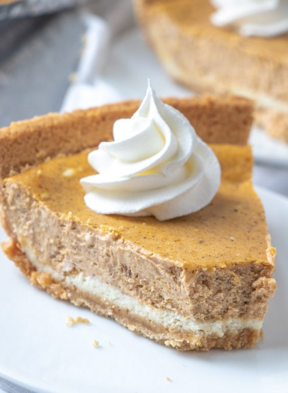 Easy, Creamy Double Layer Pumpkin Cheesecake recipe is a fall classic, and great alternative to pumpkin pie or pumpkin bars, especially for those cheesecake fans out there! This is the perfect fall, Thanksgiving, and Christmas dessert!