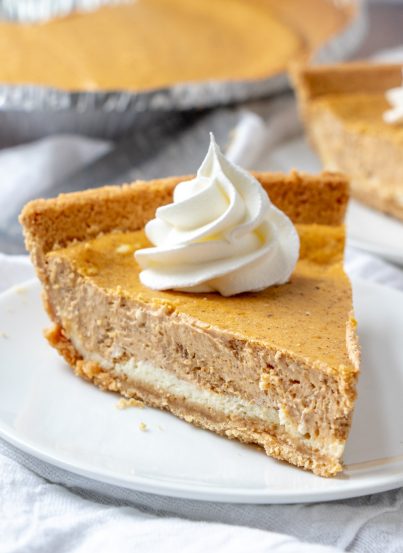 Rich and creamy Double Layer Pumpkin Cheesecake recipe is a fall classic, and great alternative to pumpkin pie, especially for those cheesecake fans out there! This is the perfect holiday dessert!