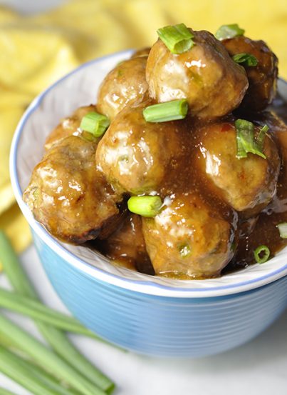Baked Orange Meatballs dinner recipe that is also perfect on an appetizer buffet or as a little game day snack with a sweet Asian sauce to nibble on! Great for a crowd!