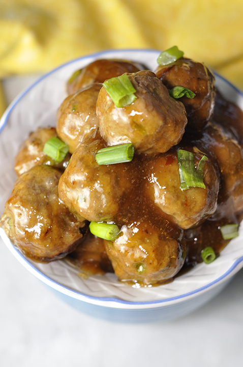 Baked Orange Meatballs dinner recipe that is also perfect on an appetizer buffet or as a little game day snack with a sweet Asian sauce to nibble on! Great for a crowd or potluck!