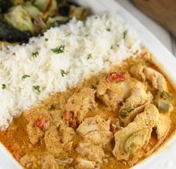 Quick and easy Thai Style Red Curry Chicken: boneless chicken thighs simmered in a red curry and coconut milk sauce. If you are a lover of Thai food you will be a huge fan of this meal!