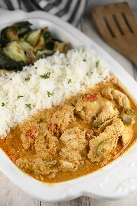 Quick and easy Thai Style Red Curry Chicken: boneless chicken thighs simmered in a red curry and coconut milk sauce. If you are a lover of Thai food you will be a huge fan of this meal!