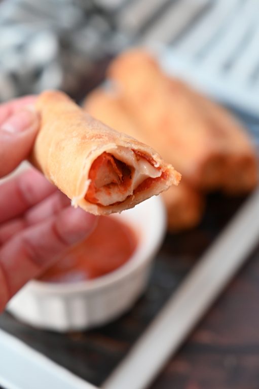 Crowd-Pleasing Baked Pepperoni Pizza Rolls recipe using egg roll wrappers is my version of the store-bought pizza rolls or pizza logs you find at diners or fast food places. These rolls are baked, not fried!