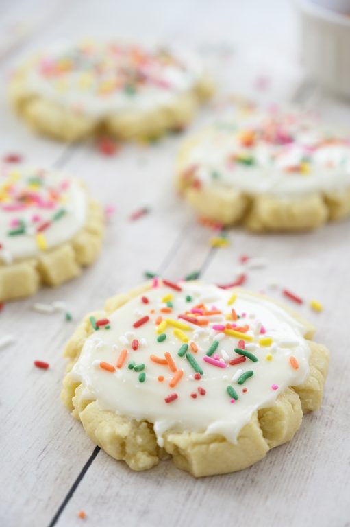 The very best Copycat Bakery Frosted Swig Sugar Cookies recipe - no chilling of the dough, rolling out the dough, or cutting them out with cookie cutters! These easy cookies are so soft, buttery, and so perfectly delicious!