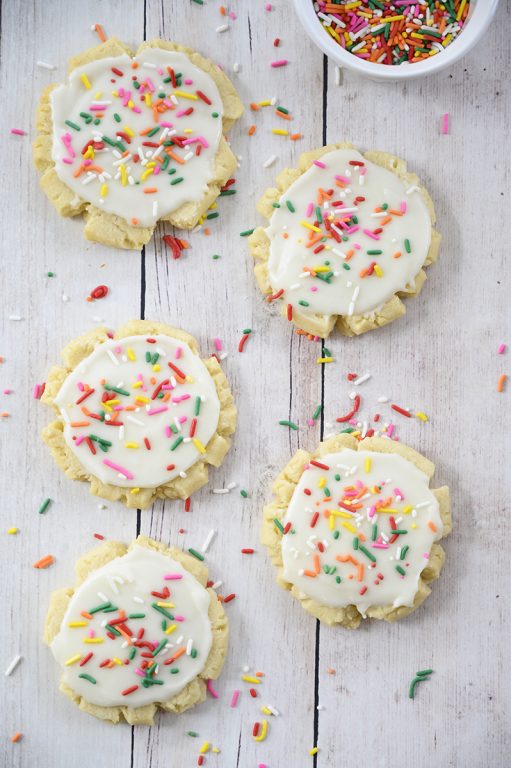 The absolute best Copycat Bakery Frosted Swig Sugar Cookies recipe - no chilling of the dough, rolling out the dough, or cutting them out with cookie cutters! These easy cookies are so soft, buttery, and so delicious!