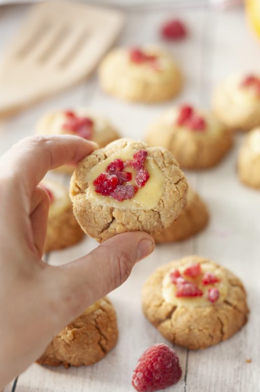 Easy New York Raspberry Cheesecake Cookies recipe perfect for Valentine's Day or any holiday dessert! Your favorite dessert made into perfectly balanced sweet and tart cookies with fresh raspberries or other fruit on top.