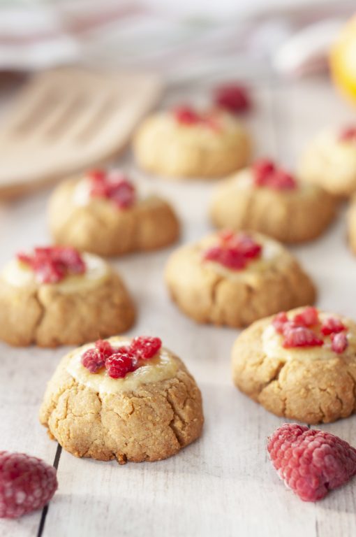 New York Raspberry Cheesecake Cookies recipe perfect for Valentine's Day or any holiday dessert! Your favorite dessert made into perfectly balanced sweet and tart cookies with fresh raspberries on top.