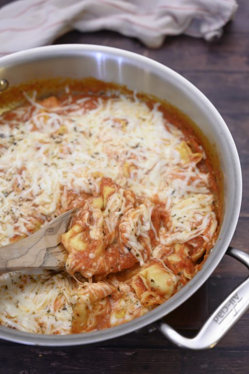 One Pot Cheesy Tortellini Skillet is a quick and easy Italian dinner idea made all in one pan for easy cleanup and delicious tasting Italian food the whole family - kids and adults alike- will devour!