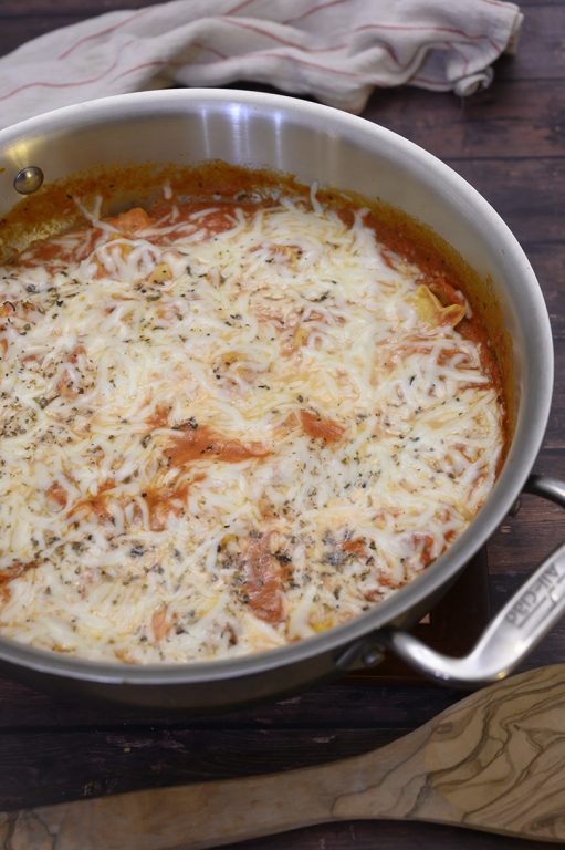 One Pot Cheesy Tortellini Skillet is an easy Italian dinner idea made all in one pan for easy cleanup and delicious tasting Italian food the whole family - kids and adults alike- will devour!