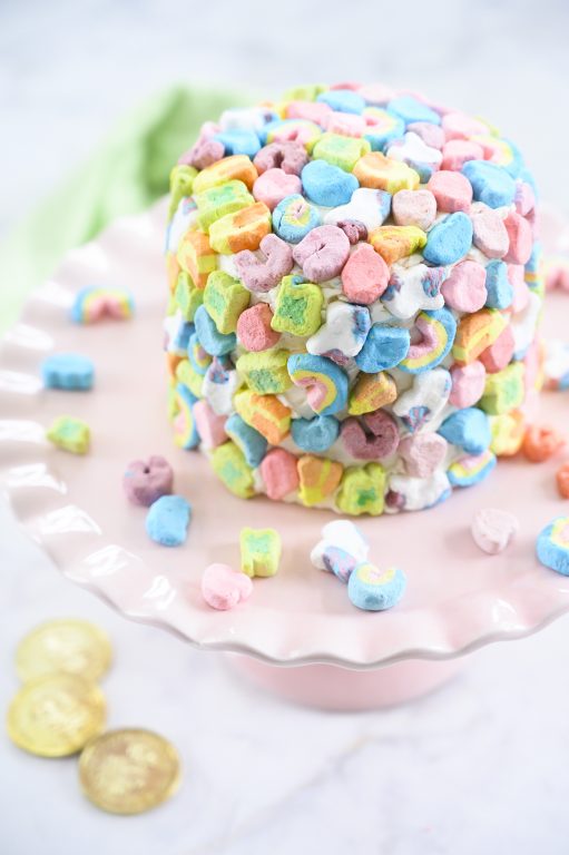 Easy Lucky Charms Layer Cake is such a fun dessert recipe that kids can help make for Saint Patrick's Day! Moist vanilla cake with vanilla buttercream frosting is a versatile recipe you can use for any birthday or special occasion.