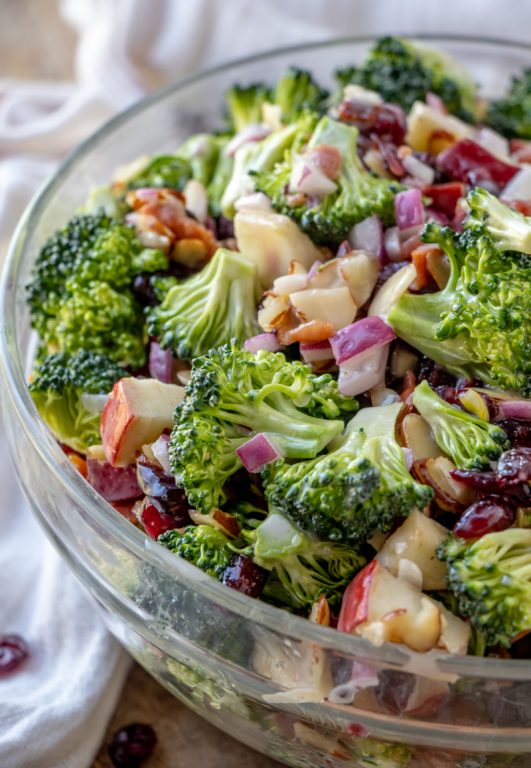 Easy Bacon and Apple Broccoli Salad is the perfect potluck or summer picnic side dish loaded with bacon, almonds, and sweet apples! You can prep this side dish salad with the homemade dressing in less than 20 minutes.