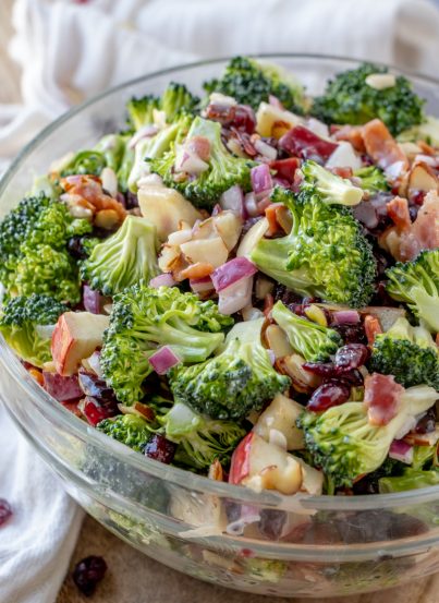 Bacon and Apple Broccoli Salad is the perfect side dish, potluck or summer picnic side dish loaded with bacon, almonds, and sweet apples! You can make this ahead of time with the homemade dressing in less than 20 minutes.