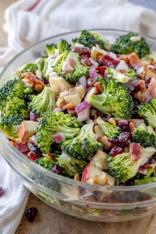 Bacon and Apple Broccoli Salad is the perfect side dish, potluck or summer picnic side dish loaded with bacon, almonds, and sweet apples! You can make this ahead of time with the homemade dressing in less than 20 minutes.