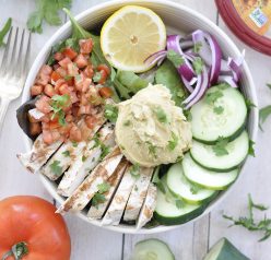 Power Chicken Hummus Bowl is a cross between a salad and a bowl and is a healthy Mediterranean-inspired recipe perfect for lunches or easy weeknight dinners!