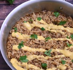 Skillet Taco Rice with Queso filled with tex-mex flavor is an easy, cheesy Mexican dinner recipe idea with simple ingredients! You will want to eat this every day and it is low carb!