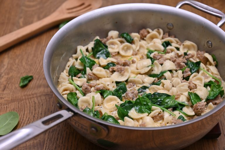 Creamy Spinach Sausage Pasta is an easy pasta dish recipe made in 30 minutes. Pasta and seasoned Italian sausage tossed in a simple, light cream sauce making it the perfect weeknight meal!