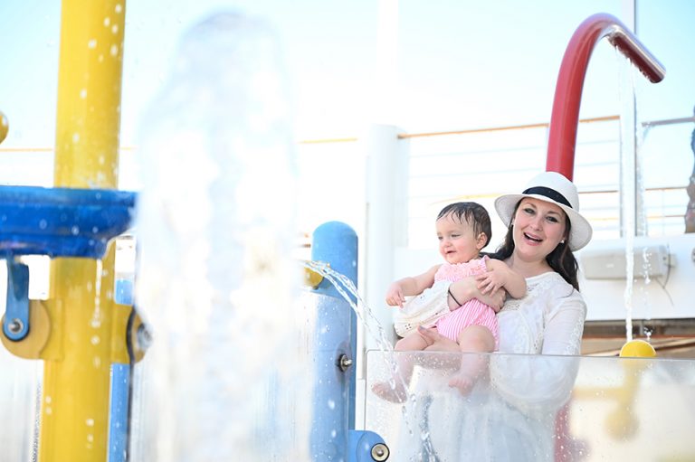 Swimming in the baby Splash zone pool on board Royal Caribbean Symphony of the Seas caribbean cruise. 